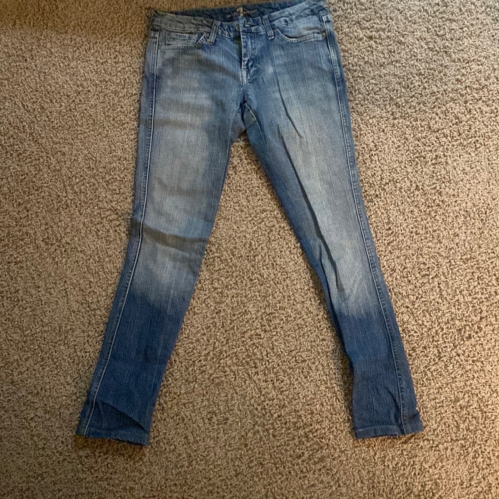 The pants are low-rise and vintage